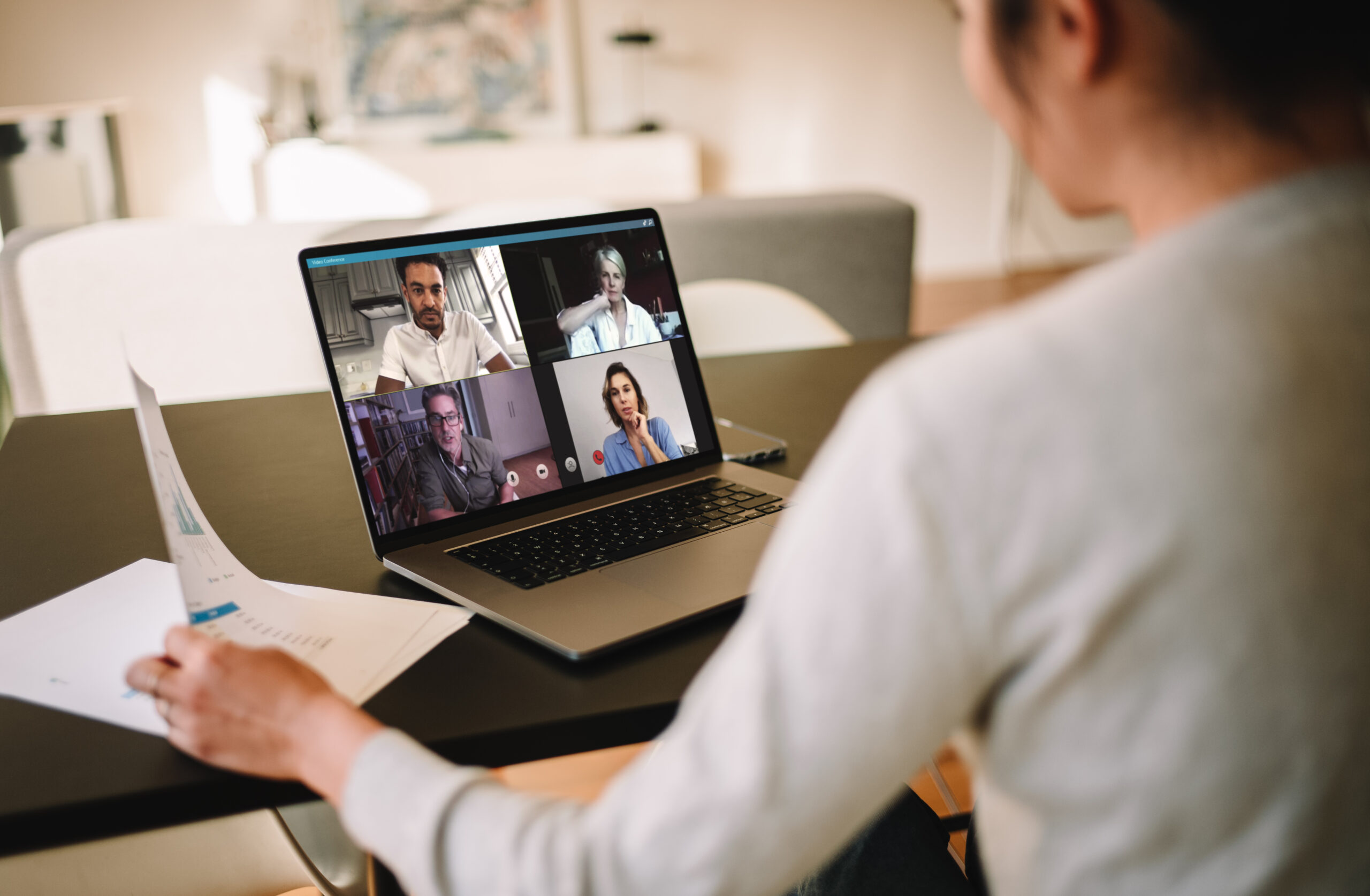 Woman on video call with colleagues